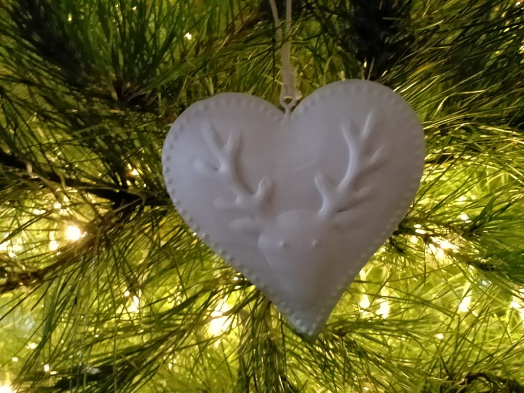 Christmas heart decoration on a real Christmas tree