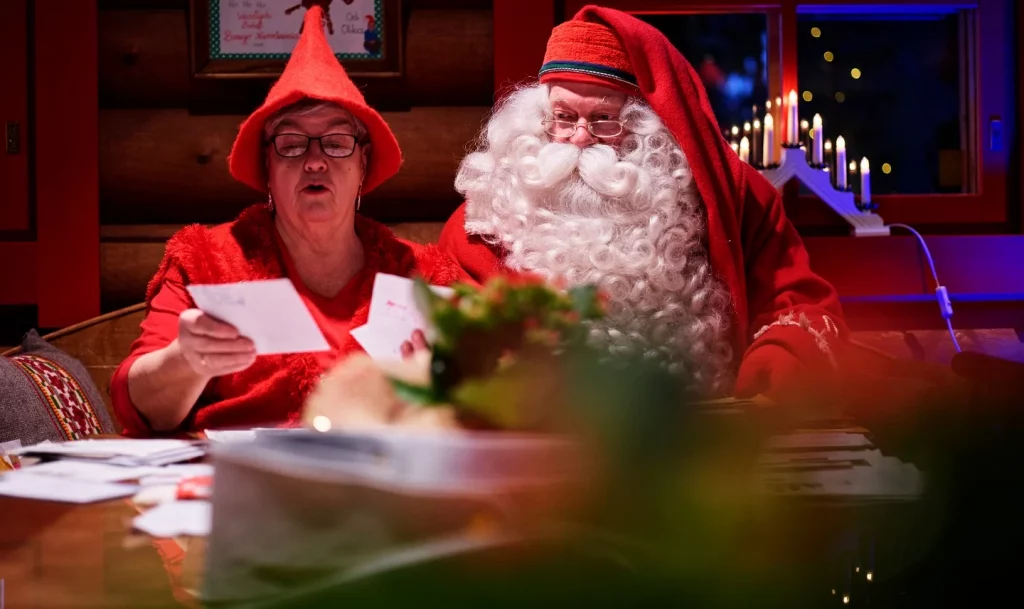 Father Christmas reading personalised Christmas letters